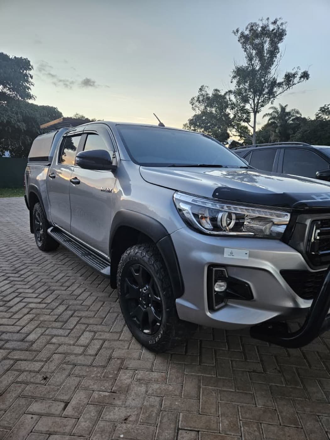 The same silver Toyota Hilux after a full Motor Madness rebuild, fitted with a canopy