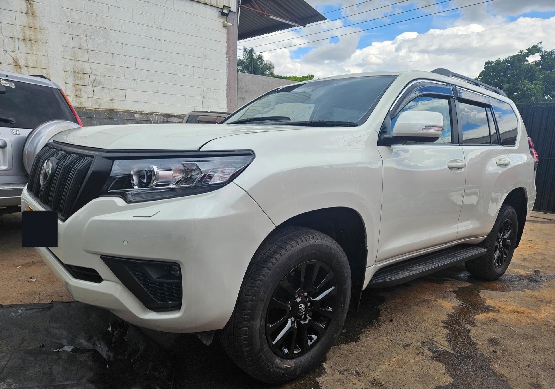 The same white Toyota Prado after a full Motor Madness rebuild, showroom-fresh